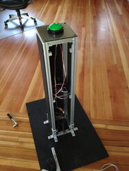Concert Cam's button tower with a large arcade button on top of a metal frame