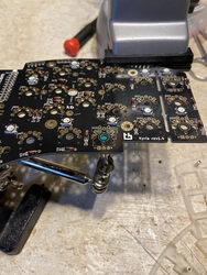 A close up of assembling the Kyria circuit board