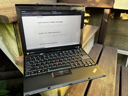 A final beauty shot of the X210 outside on a step in the sunlight